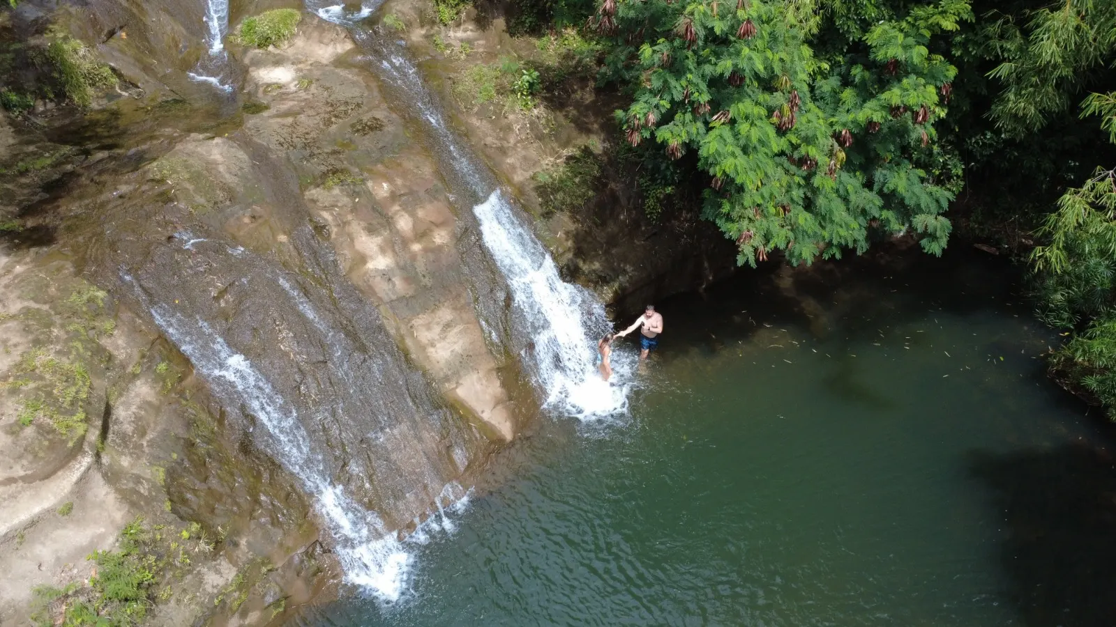 Aerial view of a hidden waterfall swimming pool